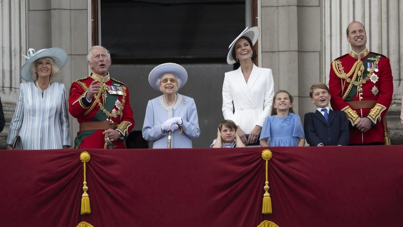 Members of the public fill The Mall ahead of a flypast over Buckingham Palace, during the Trooping the Color in London, Thursday, June 2, 2022, on the first of four days of celebrations to mark the Platinum Jubilee. The events over a long holiday weekend in the U.K. are meant to celebrate the monarch's 70 years of service. (Paul Ellis/Pool Photo via AP)