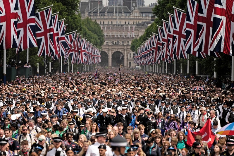 Britain Platinum Jubilee Photo Gallery Members of the public fill The Mall ahead of a flypast over Buckingham Palace, during the Trooping the Color in London, Thursday, June 2, 2022, on the first of four days of celebrations to mark the Platinum Jubilee. The events over a long holiday weekend in the U.K. are meant to celebrate the monarch's 70 years of service. (Paul Ellis/Pool Photo via AP)