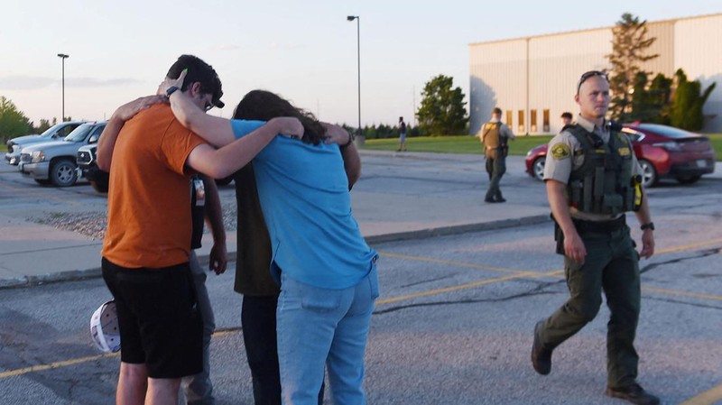Troopers from the Iowa State Patrol stand outside Cornerstone Church after a shooting on Thursday, June 2, 2022 in Ames, Iowa. Two people and a shooter died Thursday night in a shooting outside a church in Ames, authorities said. (Nirmalendu Majumdar/The Des Moines Register via AP)