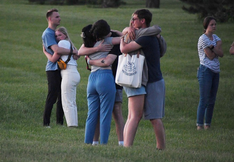 Troopers from the Iowa State Patrol stand outside Cornerstone Church after a shooting on Thursday, June 2, 2022 in Ames, Iowa. Two people and a shooter died Thursday night in a shooting outside a church in Ames, authorities said. (Nirmalendu Majumdar/The Des Moines Register via AP)