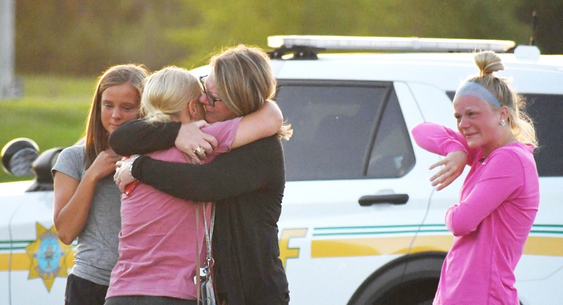 Troopers from the Iowa State Patrol stand outside Cornerstone Church after a shooting on Thursday, June 2, 2022 in Ames, Iowa. Two people and a shooter died Thursday night in a shooting outside a church in Ames, authorities said. (Nirmalendu Majumdar/The Des Moines Register via AP)