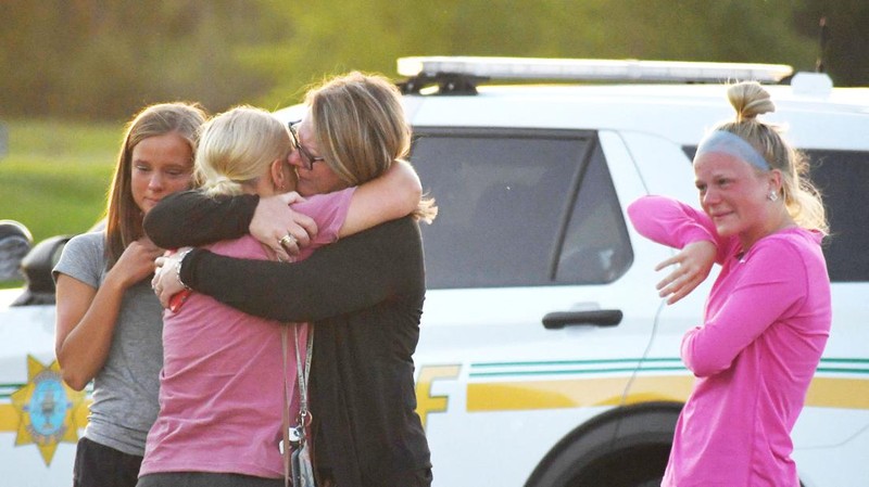 Troopers from the Iowa State Patrol stand outside Cornerstone Church after a shooting on Thursday, June 2, 2022 in Ames, Iowa. Two people and a shooter died Thursday night in a shooting outside a church in Ames, authorities said. (Nirmalendu Majumdar/The Des Moines Register via AP)