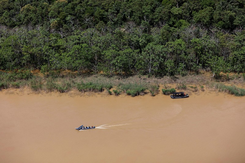 Police officers and rescue team conduct a search operation for British journalist Dom Phillips and indigenous expert Bruno Pereira, who went missing while reporting in a remote and lawless part of the Amazon rainforest near the border with Peru, in Atalaia do Norte, Amazonas state, Brazil, June 10, 2022.REUTERS/Bruno Kelly