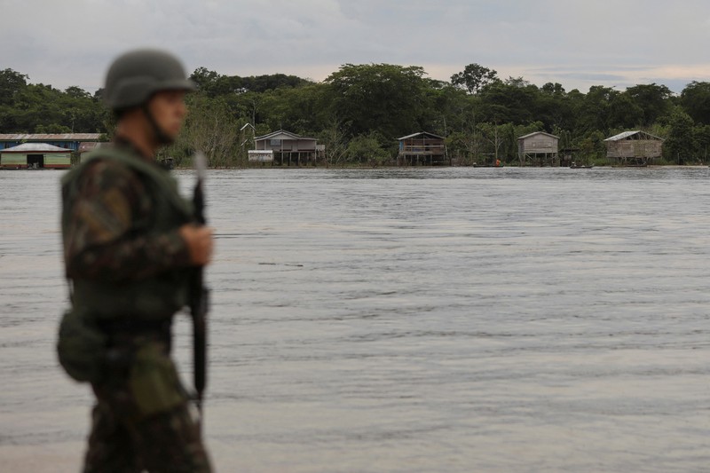 Police officers and rescue team conduct a search operation for British journalist Dom Phillips and indigenous expert Bruno Pereira, who went missing while reporting in a remote and lawless part of the Amazon rainforest near the border with Peru, in Atalaia do Norte, Amazonas state, Brazil, June 10, 2022.REUTERS/Bruno Kelly
