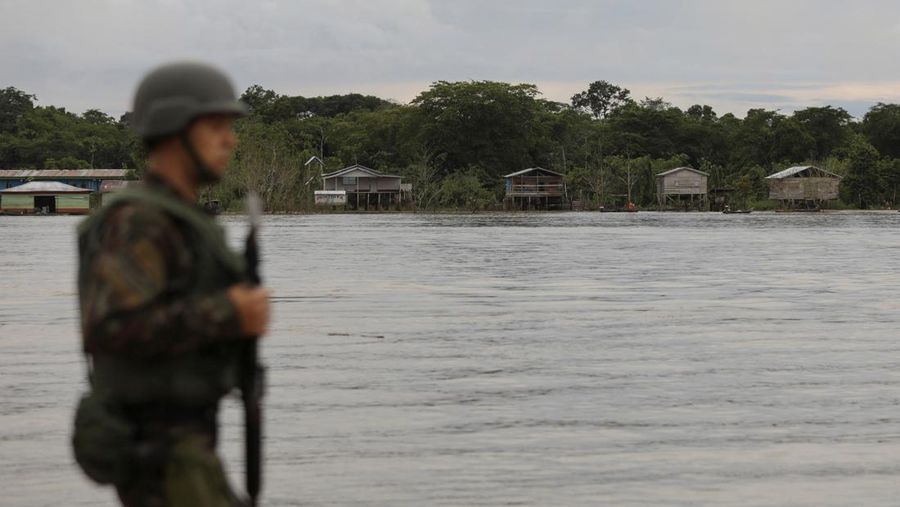 Police officers and rescue team conduct a search operation for British journalist Dom Phillips and indigenous expert Bruno Pereira, who went missing while reporting in a remote and lawless part of the Amazon rainforest near the border with Peru, in Atalaia do Norte, Amazonas state, Brazil, June 10, 2022.REUTERS/Bruno Kelly