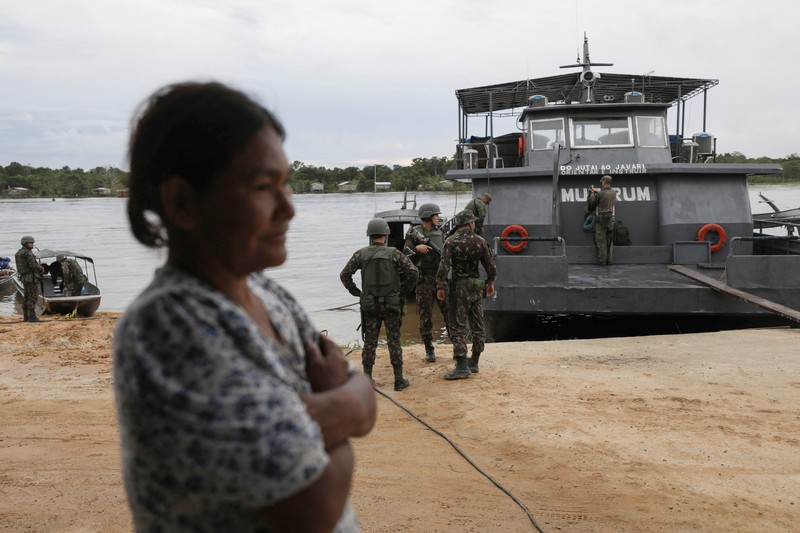 Police officers and rescue team conduct a search operation for British journalist Dom Phillips and indigenous expert Bruno Pereira, who went missing while reporting in a remote and lawless part of the Amazon rainforest near the border with Peru, in Atalaia do Norte, Amazonas state, Brazil, June 10, 2022.REUTERS/Bruno Kelly