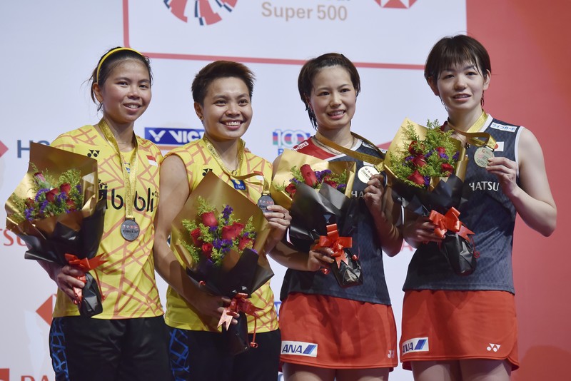 Indonesia Badminton Thomas Uber Cup Indonesia's Greysia Polii, right, carries the Indonesian flag after defeating Germany's Brigit Overzier and Kathrin Piotrowski during their semi-final of the Uber Cup badminton championship match at Istora Senayan stadium in Jakarta, Indonesia, Thursday, May 15, 2008. (AP Photo/Firdia Lisnawati)