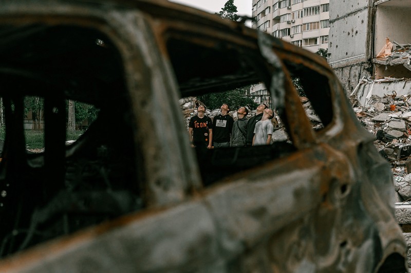 Students pose in front of a destroyed military vehicle for a high school graduation photoshoot, as Russia's attack on Ukraine continues, in Chernihiv, Ukraine, June 5, 2022. Picture taken on June 5, 2022. Instagram/@senykstas/Handout via REUTERS  THIS IMAGE HAS BEEN SUPPLIED BY A THIRD PARTY. MANDATORY CREDIT. NO RESALES. NO ARCHIVES.