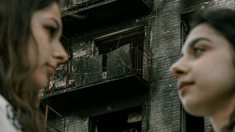 Students pose in front of a destroyed military vehicle for a high school graduation photoshoot, as Russia's attack on Ukraine continues, in Chernihiv, Ukraine, June 5, 2022. Picture taken on June 5, 2022. Instagram/@senykstas/Handout via REUTERS  THIS IMAGE HAS BEEN SUPPLIED BY A THIRD PARTY. MANDATORY CREDIT. NO RESALES. NO ARCHIVES.