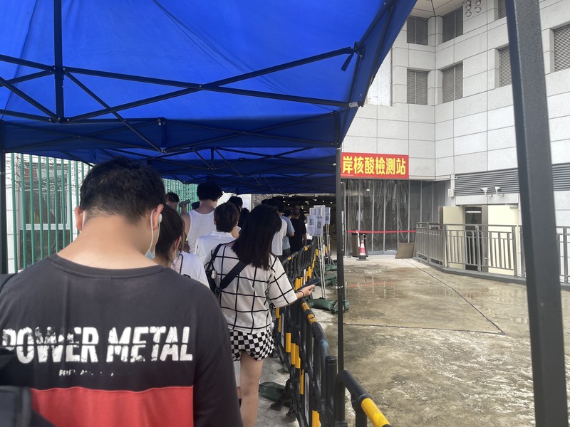 MACAO, CHINA - JUNE 19: People queue up for COVID-19 nucleic acid tests on June 19, 2022 in Macao, China. (Photo by VCG/VCG via Getty Images)