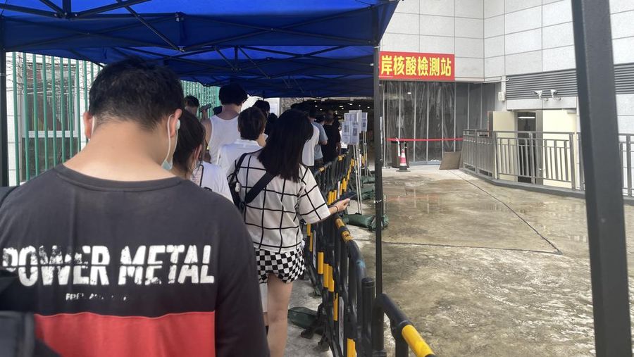 MACAO, CHINA - JUNE 19: People queue up for COVID-19 nucleic acid tests on June 19, 2022 in Macao, China. (Photo by VCG/VCG via Getty Images)