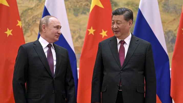 FILE - Chinese President Xi Jinping, right, and Russian President Vladimir Putin talk to each other during their meeting in Beijing, China, Friday, Feb. 4, 2022. Xi has reasserted his country's support for Russia on “issues concerning core interests and major concerns such as sovereignty and security,