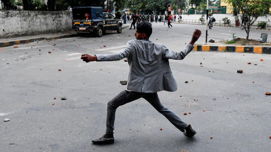 Student activists clash with police during a protest over hike in fuel prices in Kathmandu on June 20, 2022. (Photo by PRAKASH MATHEMA / AFP) (Photo by PRAKASH MATHEMA/AFP via Getty Images)