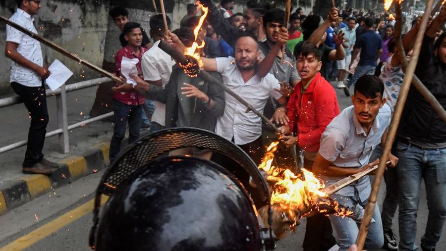 Student activists clash with police during a protest over hike in fuel prices in Kathmandu on June 20, 2022. (Photo by PRAKASH MATHEMA / AFP) (Photo by PRAKASH MATHEMA/AFP via Getty Images)