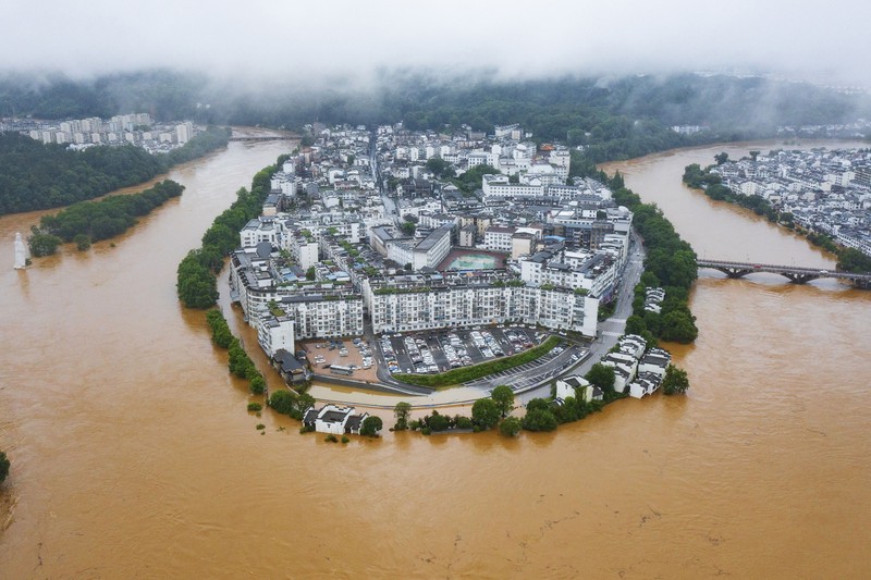 SHANGRAO, CHINA - JUNE 21: Aerial view of vehicles submerged in flood water on June 21, 2022 in Shangrao, Jiangxi Province of China. China's Jiangxi Province on Monday issued a red alert for floods. (Photo by Ai Shimin/VCG via Getty Images)