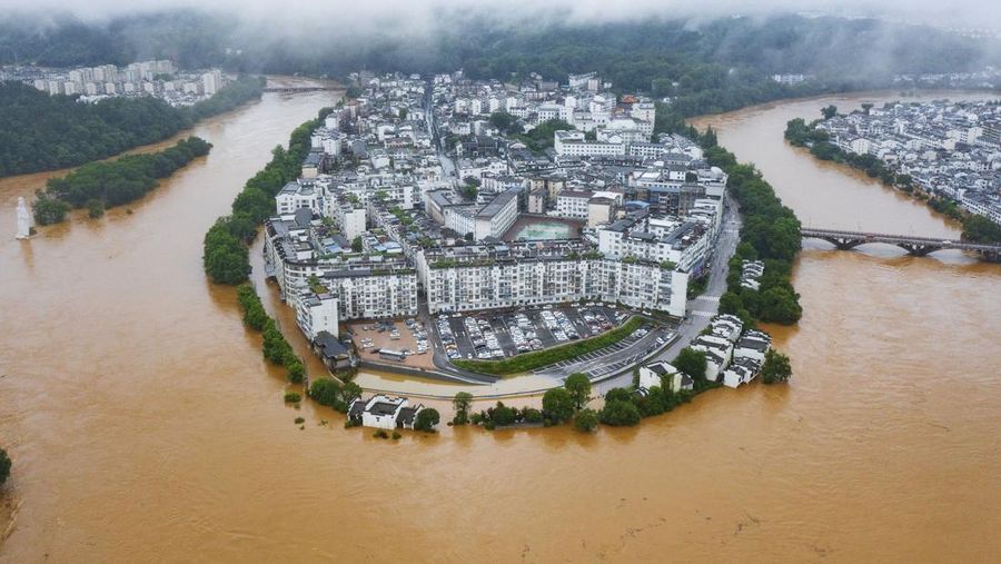 SHANGRAO, CHINA - JUNE 21: Aerial view of vehicles submerged in flood water on June 21, 2022 in Shangrao, Jiangxi Province of China. China's Jiangxi Province on Monday issued a red alert for floods. (Photo by Ai Shimin/VCG via Getty Images)