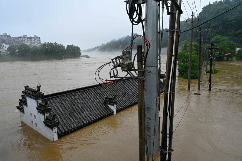 SHANGRAO, CHINA - JUNE 21: Aerial view of vehicles submerged in flood water on June 21, 2022 in Shangrao, Jiangxi Province of China. China's Jiangxi Province on Monday issued a red alert for floods. (Photo by Ai Shimin/VCG via Getty Images)