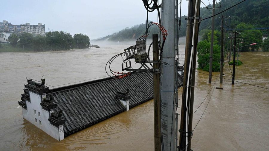 SHANGRAO, CHINA - JUNE 21: Aerial view of vehicles submerged in flood water on June 21, 2022 in Shangrao, Jiangxi Province of China. China's Jiangxi Province on Monday issued a red alert for floods. (Photo by Ai Shimin/VCG via Getty Images)