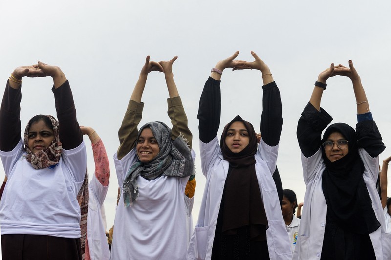 India's Prime Minister Narendra Modi (C) performs yoga with others to celebrate the International Day of Yoga in front of the Mysore Palace in Mysore on June 21, 2022. (Photo by Manjunath Kiran / AFP) (Photo by MANJUNATH KIRAN/AFP via Getty Images)