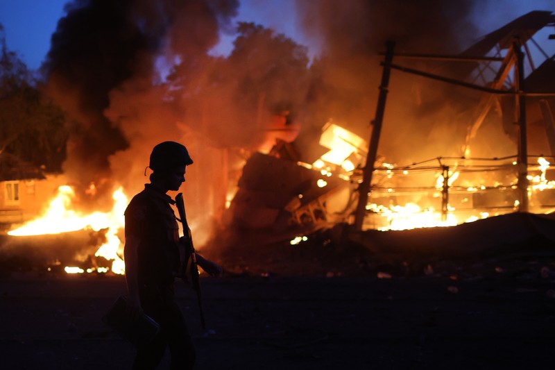 DRUZHKIVKA, UKRAINE - JUNE 20: Flames rise from a structure after it was hit by a projectile on June 20, 2022 in Druzhkivka, Ukraine. In recent weeks, Russia has concentrated its firepower on Ukraine's Donbas region, where it has long backed two separatist regions at war with the Ukrainian government since 2014. (Photo by Scott Olson/Getty Images)(Photo by Scott Olson/Getty Images)
