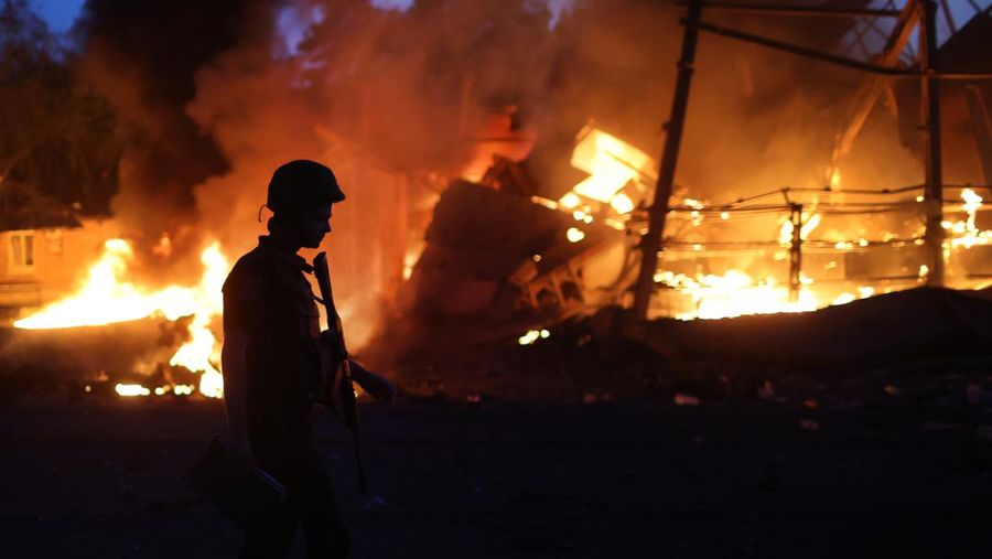 DRUZHKIVKA, UKRAINE - JUNE 20: Flames rise from a structure after it was hit by a projectile on June 20, 2022 in Druzhkivka, Ukraine. In recent weeks, Russia has concentrated its firepower on Ukraine's Donbas region, where it has long backed two separatist regions at war with the Ukrainian government since 2014. (Photo by Scott Olson/Getty Images)(Photo by Scott Olson/Getty Images)