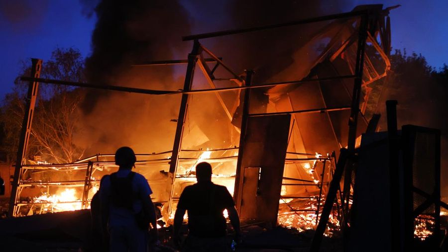 DRUZHKIVKA, UKRAINE - JUNE 20: Flames rise from a structure after it was hit by a projectile on June 20, 2022 in Druzhkivka, Ukraine. In recent weeks, Russia has concentrated its firepower on Ukraine's Donbas region, where it has long backed two separatist regions at war with the Ukrainian government since 2014. (Photo by Scott Olson/Getty Images)(Photo by Scott Olson/Getty Images)