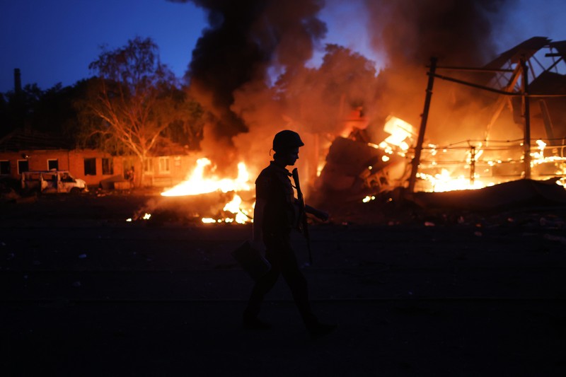 DRUZHKIVKA, UKRAINE - JUNE 20: Flames rise from a structure after it was hit by a projectile on June 20, 2022 in Druzhkivka, Ukraine. In recent weeks, Russia has concentrated its firepower on Ukraine's Donbas region, where it has long backed two separatist regions at war with the Ukrainian government since 2014. (Photo by Scott Olson/Getty Images)(Photo by Scott Olson/Getty Images)