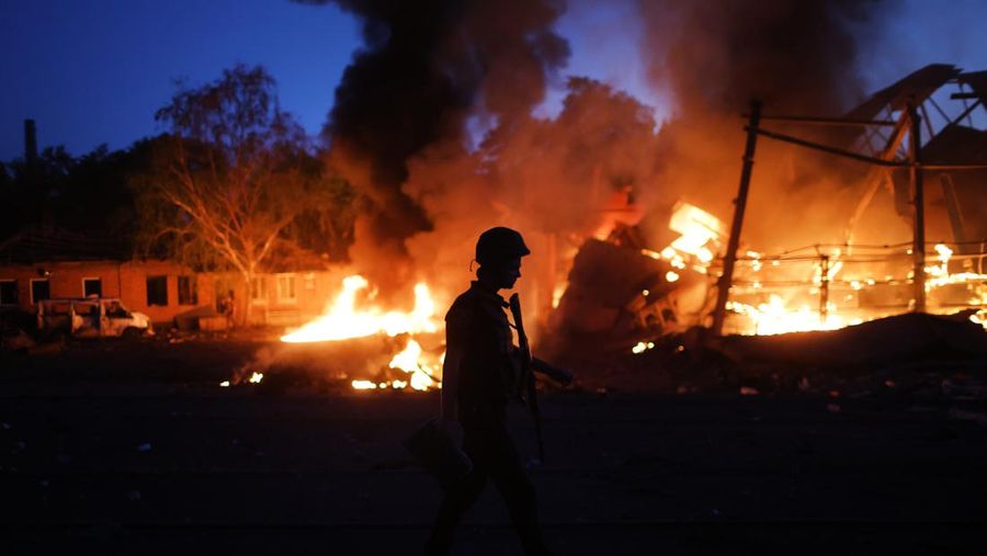 DRUZHKIVKA, UKRAINE - JUNE 20: Flames rise from a structure after it was hit by a projectile on June 20, 2022 in Druzhkivka, Ukraine. In recent weeks, Russia has concentrated its firepower on Ukraine's Donbas region, where it has long backed two separatist regions at war with the Ukrainian government since 2014. (Photo by Scott Olson/Getty Images)(Photo by Scott Olson/Getty Images)