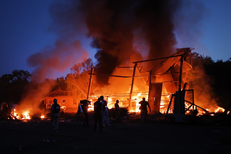 DRUZHKIVKA, UKRAINE - JUNE 20: Flames rise from a structure after it was hit by a projectile on June 20, 2022 in Druzhkivka, Ukraine. In recent weeks, Russia has concentrated its firepower on Ukraine's Donbas region, where it has long backed two separatist regions at war with the Ukrainian government since 2014. (Photo by Scott Olson/Getty Images)(Photo by Scott Olson/Getty Images)
