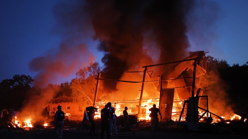 DRUZHKIVKA, UKRAINE - JUNE 20: Flames rise from a structure after it was hit by a projectile on June 20, 2022 in Druzhkivka, Ukraine. In recent weeks, Russia has concentrated its firepower on Ukraine's Donbas region, where it has long backed two separatist regions at war with the Ukrainian government since 2014. (Photo by Scott Olson/Getty Images)(Photo by Scott Olson/Getty Images)