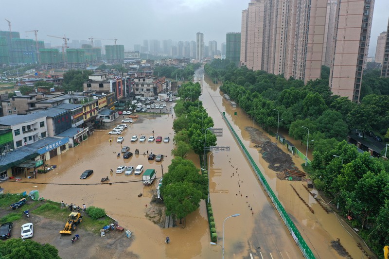 SHANGRAO, CHINA - JUNE 21: Aerial view of vehicles submerged in flood water on June 21, 2022 in Shangrao, Jiangxi Province of China. China's Jiangxi Province on Monday issued a red alert for floods. (Photo by Ai Shimin/VCG via Getty Images)