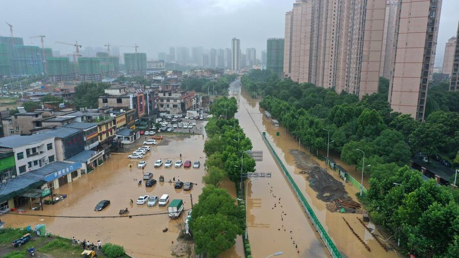 SHANGRAO, CHINA - JUNE 21: Aerial view of vehicles submerged in flood water on June 21, 2022 in Shangrao, Jiangxi Province of China. China's Jiangxi Province on Monday issued a red alert for floods. (Photo by Ai Shimin/VCG via Getty Images)