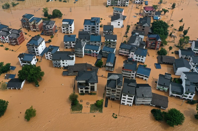 SHANGRAO, CHINA - JUNE 21: Aerial view of vehicles submerged in flood water on June 21, 2022 in Shangrao, Jiangxi Province of China. China's Jiangxi Province on Monday issued a red alert for floods. (Photo by Ai Shimin/VCG via Getty Images)