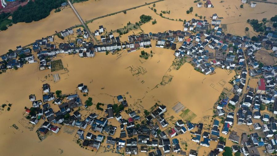 SHANGRAO, CHINA - JUNE 21: Aerial view of residential houses submerged in flood water on June 21, 2022 in Shangrao, Jiangxi Province of China. China's Jiangxi Province on Monday issued a red alert for floods. (Photo by Ai Shimin/VCG via Getty Images)