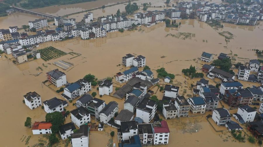 SHANGRAO, CHINA - JUNE 21: Aerial view of vehicles submerged in flood water on June 21, 2022 in Shangrao, Jiangxi Province of China. China's Jiangxi Province on Monday issued a red alert for floods. (Photo by Ai Shimin/VCG via Getty Images)