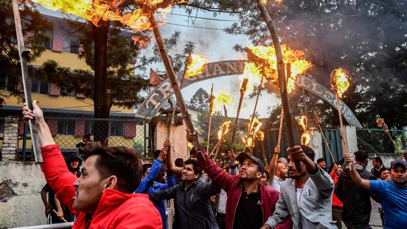 Student activists clash with police during a protest over hike in fuel prices in Kathmandu on June 20, 2022. (Photo by PRAKASH MATHEMA / AFP) (Photo by PRAKASH MATHEMA/AFP via Getty Images)