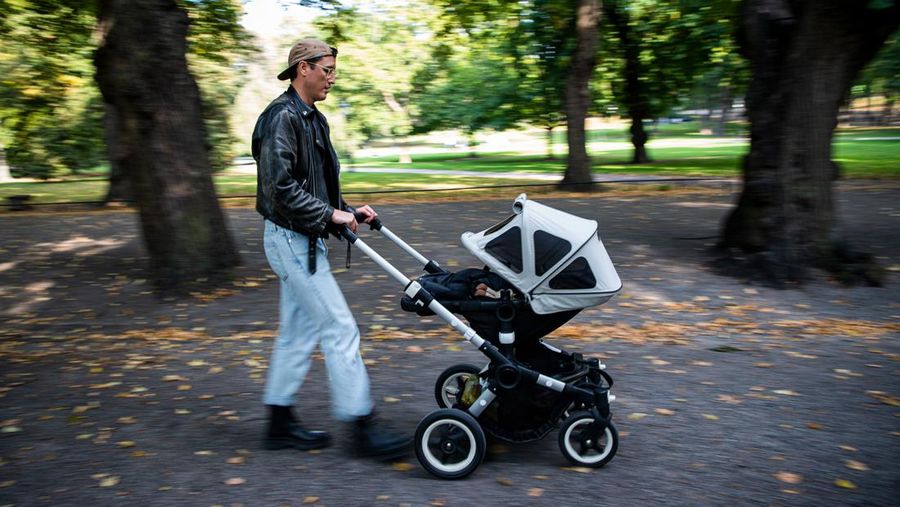 Two men take care of their babies at Humlegarden in Stockholm on September 24, 2020. - While France has just increased paternity leave to 28 days, in Sweden, a pioneer in gender equality, parents share 480 days off, which can be taken until the child's 12th birthday at 80% of the salary for the first 390 days and fathers have a minimum of three months, but only half of them take full advantage of it. (Photo by Jonathan NACKSTRAND / AFP) (Photo by JONATHAN NACKSTRAND/AFP via Getty Images)