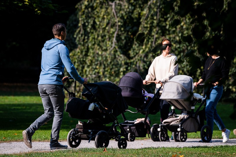parenting Two men take care of their babies at Humlegarden in Stockholm on September 24, 2020. - While France has just increased paternity leave to 28 days, in Sweden, a pioneer in gender equality, parents share 480 days off, which can be taken until the child's 12th birthday at 80% of the salary for the first 390 days and fathers have a minimum of three months, but only half of them take full advantage of it. (Photo by Jonathan NACKSTRAND / AFP) (Photo by JONATHAN NACKSTRAND/AFP via Getty Images)
