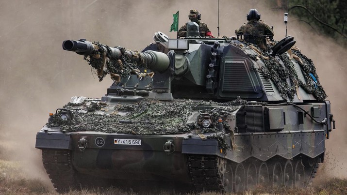 1240579256 MUNSTER, GERMANY - MAY 10: Soldiers of the Bundeswehr, the German armed forces, participate with the Panzerhaubitze 2000 - the Pzh 2000 self-propelled howitzer in the Wettiner Heide (Wettiner Meadow) international joint military exercises of NATO Response Force (Land) on May 10, 2022 near Munster, Germany. The forces include the Panzergrenadierbrigade 37 (Armoured Infantry Brigade 37), which currently leads the NATO Very High Readiness Joint Task Force (VJTF). The current exercises, which run from May 2-20, include armoured and artillery units with 7,500 soldiers from nine different nations, though mainly from Germany and the Netherlands. (Photo by Morris MacMatzen/Getty Images)