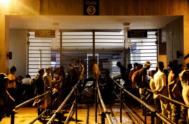 People wait to collect their passports at the Sri Lanka's Immigration and Emigration Department, amid the country's economic crisis, in Colombo, Sri Lanka, June 8, 2022. Picture taken June 8,2022.  REUTERS/Dinuka Liyanawatte