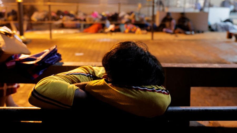A man sleeps outside the Sri Lanka's Immigration and Emigration Department amid the country's economic crisis, in Colombo, Sri Lanka, June 8, 2022. Picture taken June 8,2022. REUTERS/Dinuka Liyanawatte