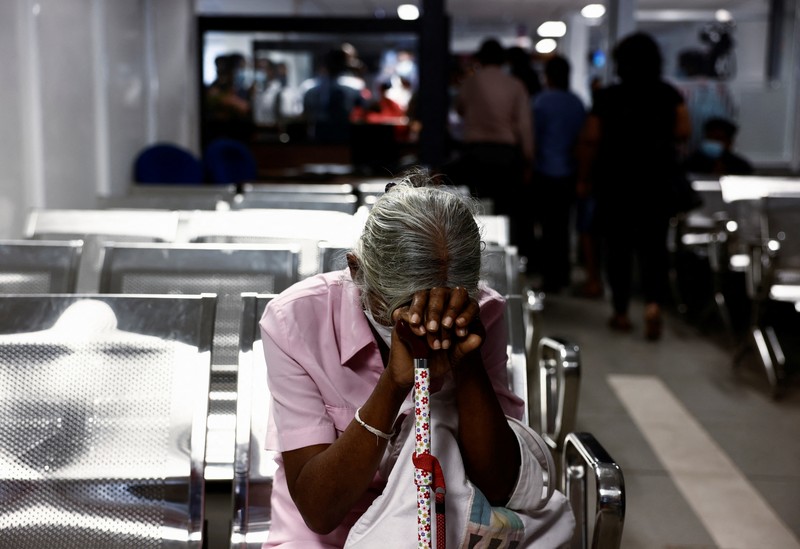 SRI LANKA-CRISIS/EMIGRATION People wait to collect their passports at the Sri Lanka's Immigration and Emigration Department, amid the country's economic crisis, in Colombo, Sri Lanka, June 8, 2022. Picture taken June 8,2022. REUTERS/Dinuka Liyanawatte