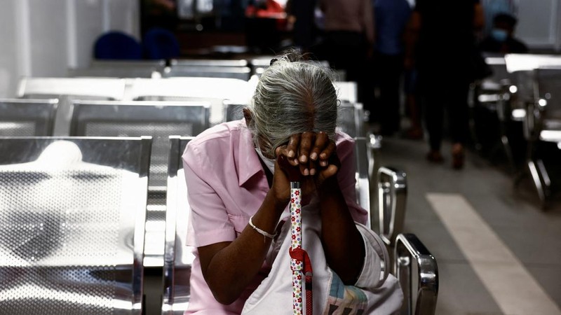 People wait to collect their passports at the Sri Lanka's Immigration and Emigration Department, amid the country's economic crisis, in Colombo, Sri Lanka, June 8, 2022. Picture taken June 8,2022.  REUTERS/Dinuka Liyanawatte
