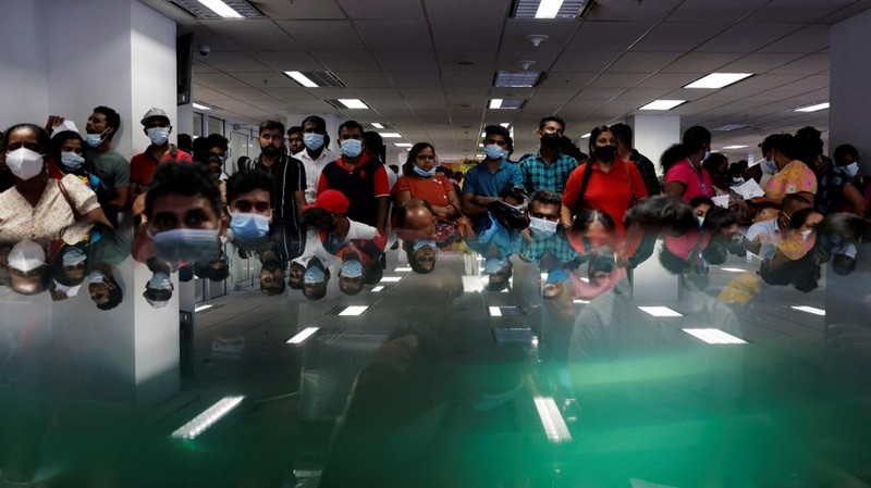 People wait to collect their passports at the Sri Lanka's Immigration and Emigration Department, amid the country's economic crisis, in Colombo, Sri Lanka, June 8, 2022. Picture taken June 8,2022.  REUTERS/Dinuka Liyanawatte
