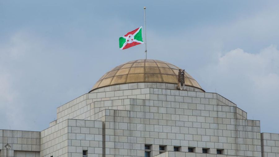Burundi's national flag is set at half-mast at the state house as Burundi mourns the death of Burundian President Pierre Nkurunziza, in Bujumbura on June 10, 2020. - The Burundian president, Pierre Nkurunziza, died on June 8, 2020 at the age of 55 the Burundian presidency announced on June 9, 2020 in a statement. (Photo by Tchandrou NITANGA / AFP) (Photo by TCHANDROU NITANGA/AFP via Getty Images)