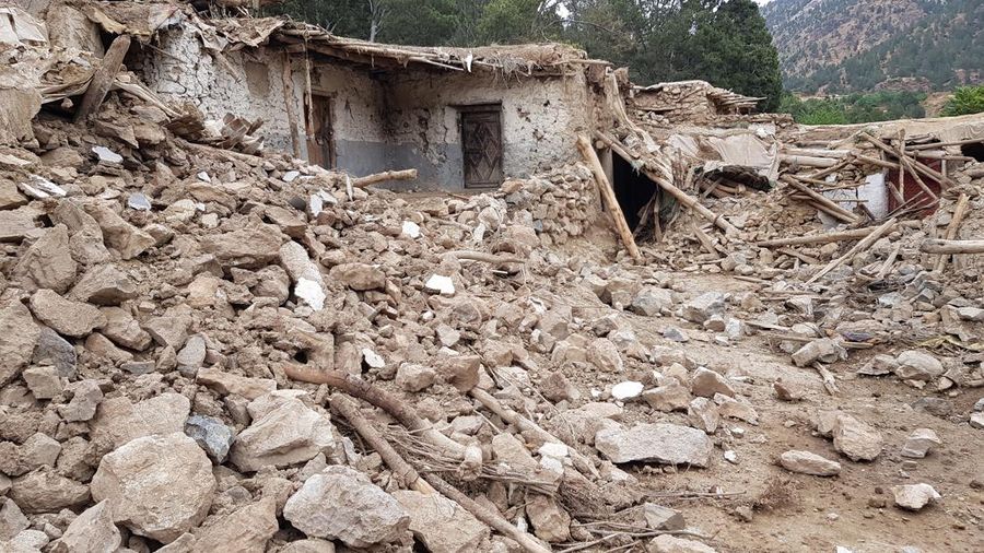 KHOST, AFGHANISTAN - JUNE 22: A view of debris after a magnitude 7.0 earthquake shook Afghanistan at noon and killed at least 29 people, and injured 62 others in the Spera district of Khost province near Paktika province, Afghanistan on June 22, 2022.. The district chief, Sultan Mahmood Ghaznavi, said the quake had destroyed about 500 houses in different parts of the district, adding that they were trying to assist the affected families in Khost. (Photo by Sardar Shafaq/Anadolu Agency via Getty Images)