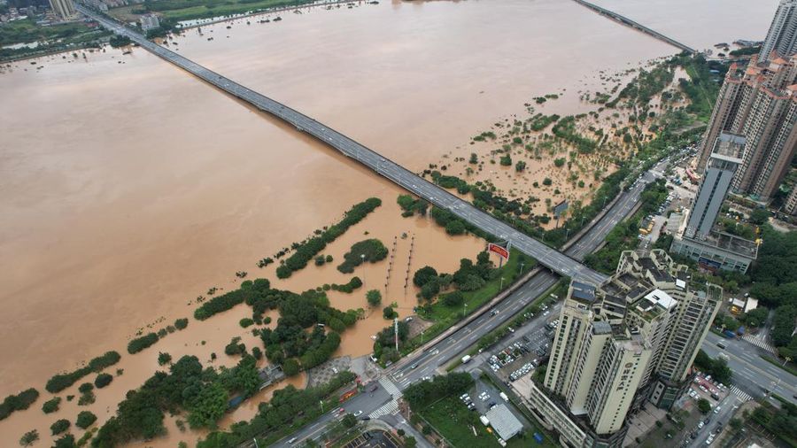QINGYUAN, CHINA - JUNE 22: Aerial view of residential houses surrounded by flood water after torrential rains on June 22, 2022 in Qingyuan, Guangdong Province of China. Flood control authority of China's Guangdong Province activated a Level-I emergency response on Tuesday. (Photo by VCG/VCG via Getty Images)