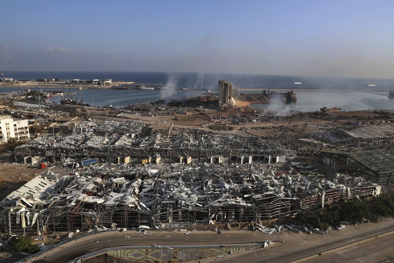 Lebanon Sri Lanka Collapse FILE- This photo shows a general view of the scene of an explosion that hit the seaport of Beirut, Lebanon, Wednesday, Aug. 5, 2020. On Aug. 4, 2020, a catastrophic explosion struck Beirut's port, killing at least 216 people and wrecking large parts of the city. The blast, widely considered one of the largest non-nuclear explosions in history, was caused by the detonation of hundreds of tons of ammonium nitrate that was stored in a warehouse for years. (AP Photo/Bilal Hussein, File)