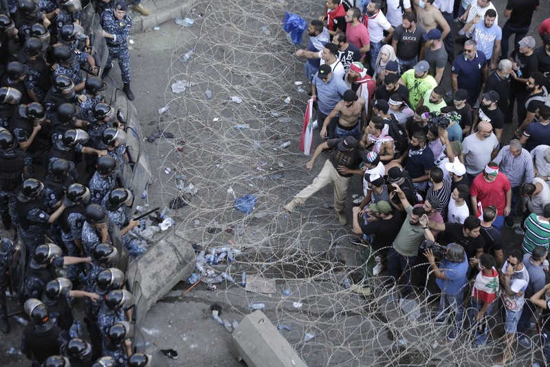 Lebanon Sri Lanka Collapse FILE- This photo shows a general view of the scene of an explosion that hit the seaport of Beirut, Lebanon, Wednesday, Aug. 5, 2020. On Aug. 4, 2020, a catastrophic explosion struck Beirut's port, killing at least 216 people and wrecking large parts of the city. The blast, widely considered one of the largest non-nuclear explosions in history, was caused by the detonation of hundreds of tons of ammonium nitrate that was stored in a warehouse for years. (AP Photo/Bilal Hussein, File)