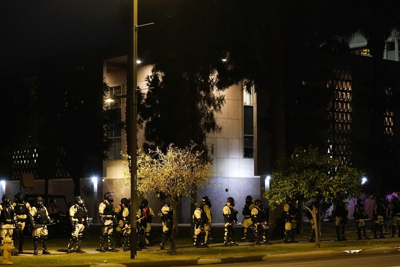 Supreme Court Abortion Arizona A large number of police surround the Arizona Capitol after protesters reached the front of the AZ Senate building following the Supreme Court's decision to overturn Roe v. Wade Friday, June 24, 2022, in Phoenix. (AP Photo/Ross D. Franklin)